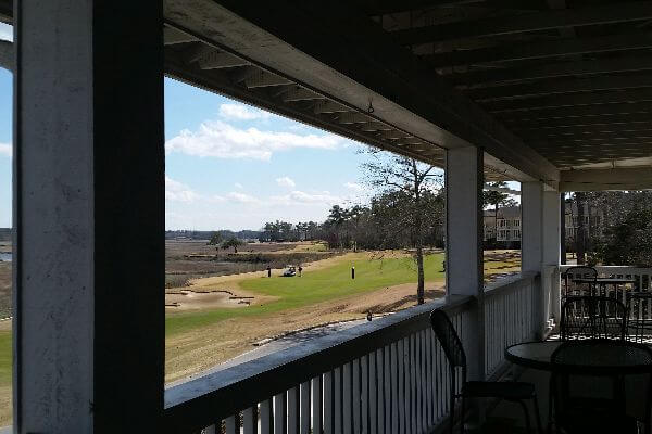 view of golf course from rear deck of condo